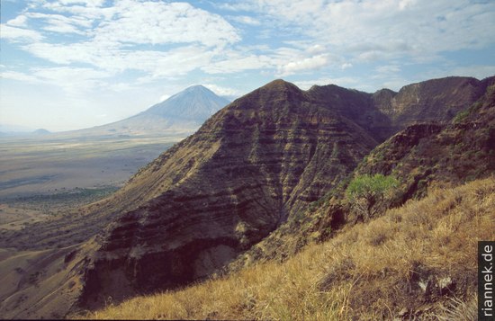 Flood lavas in the escarpment, Oldoinyo Lengai in background
